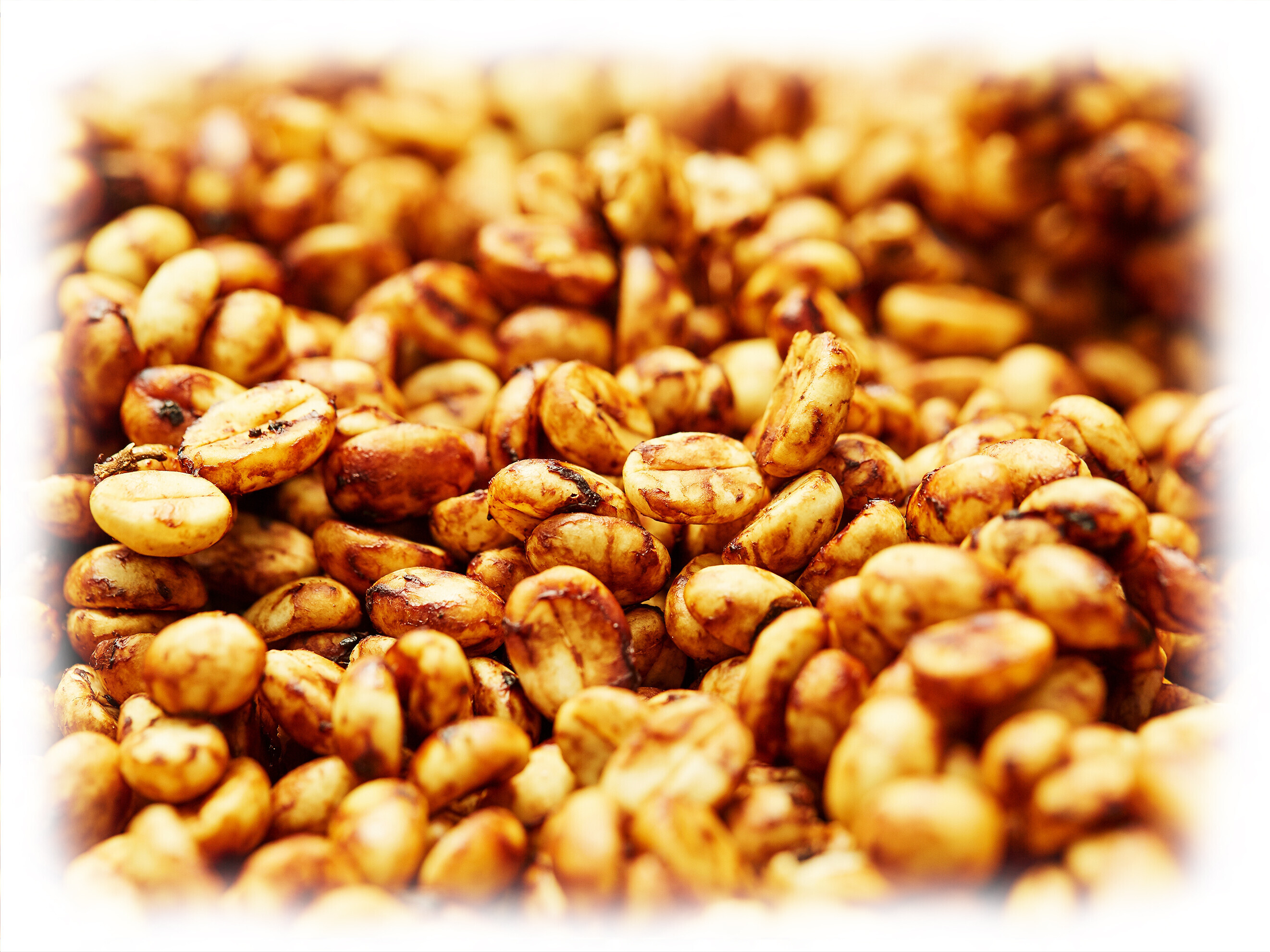 stock-photo-a-close-up-shot-of-a-pile-of-raw-fresh-coffee-beans-during-the-honey-processing-2235237299