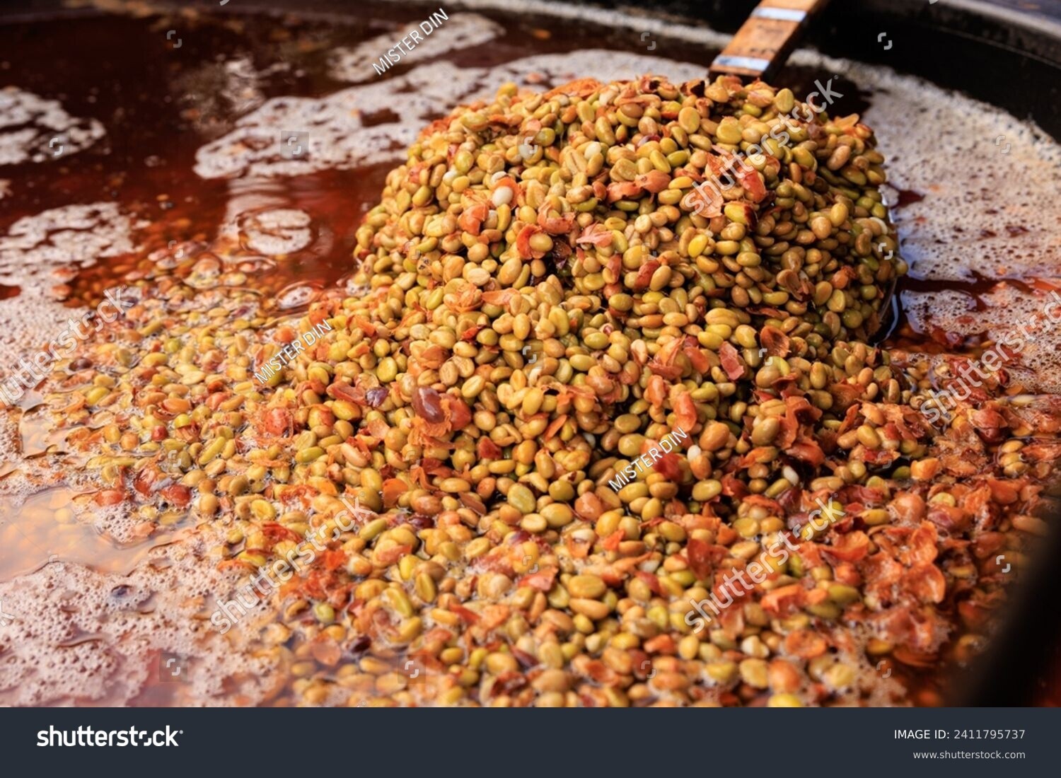 stock-photo-farmer-show-coffee-beans-in-the-ferment-and-wash-method-of-wet-processing-in-container-2411282991